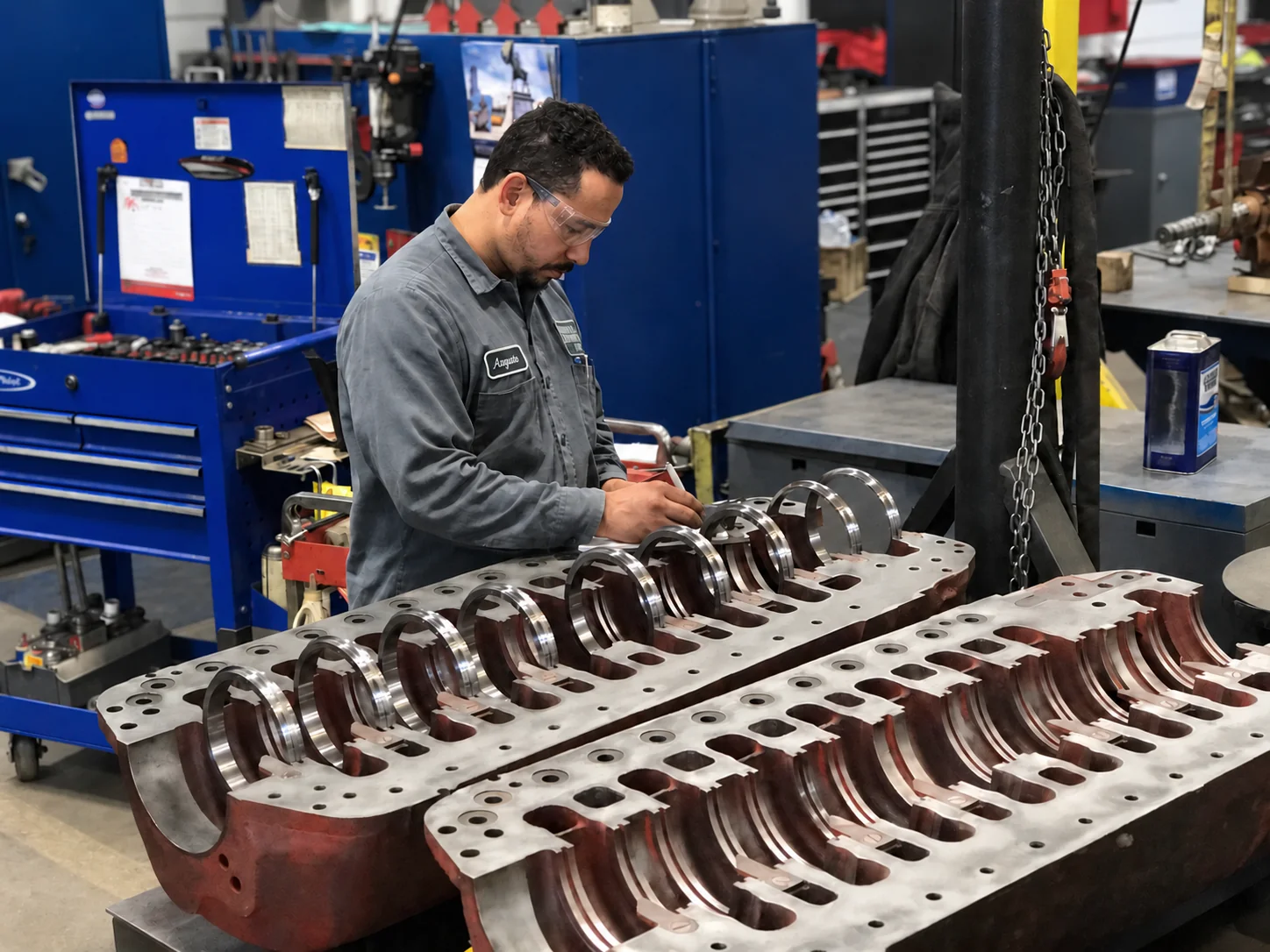 Technician examining an open pump casing in the shop