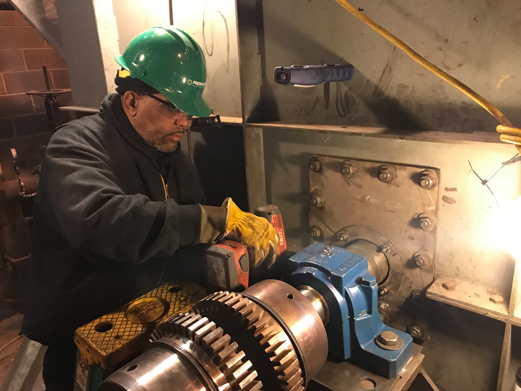 Technician working on a fan shaft assembly