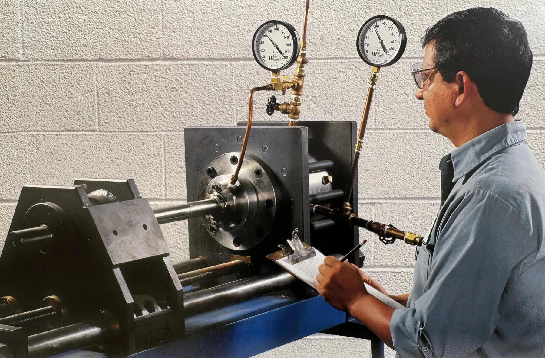 Technician testing a mechanical seal with a pressure gauge